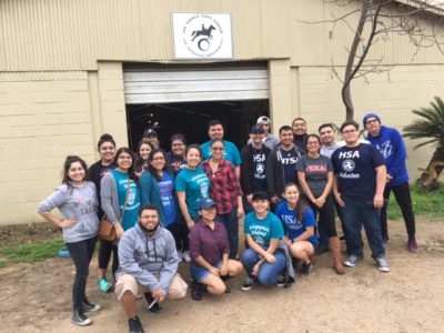 Hispanic student association at UTSA volunteering at the Saddle Light Center